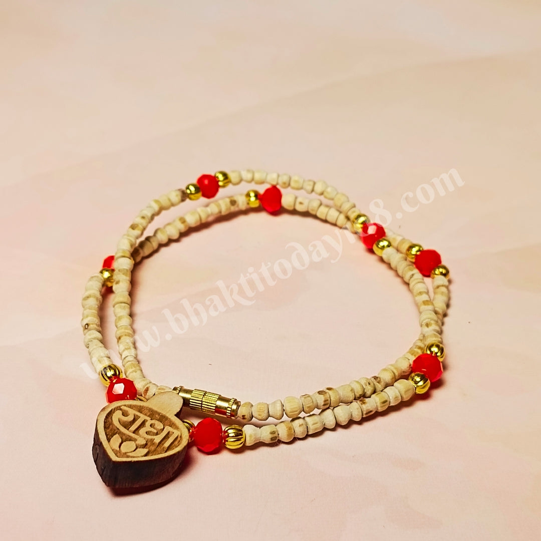 Radha Naam Golden Tulsi Mala with red and golden beads and a small Radha Naam locket – handcrafted spiritual necklace made from pure Tulsi wood.