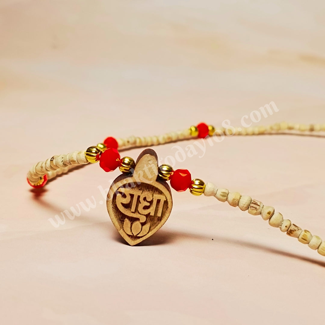 Radha Naam Golden Tulsi Mala with red and golden beads and a small Radha Naam locket – handcrafted spiritual necklace made from pure Tulsi wood.