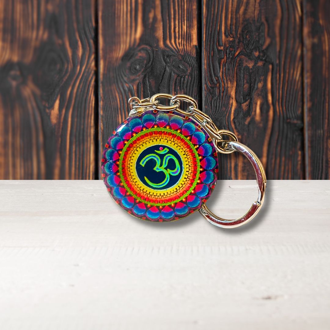 Metal Om keychain with intricate design, symbolizing spiritual harmony and divine energy—perfect for keys, bags, or as a sacred gift.