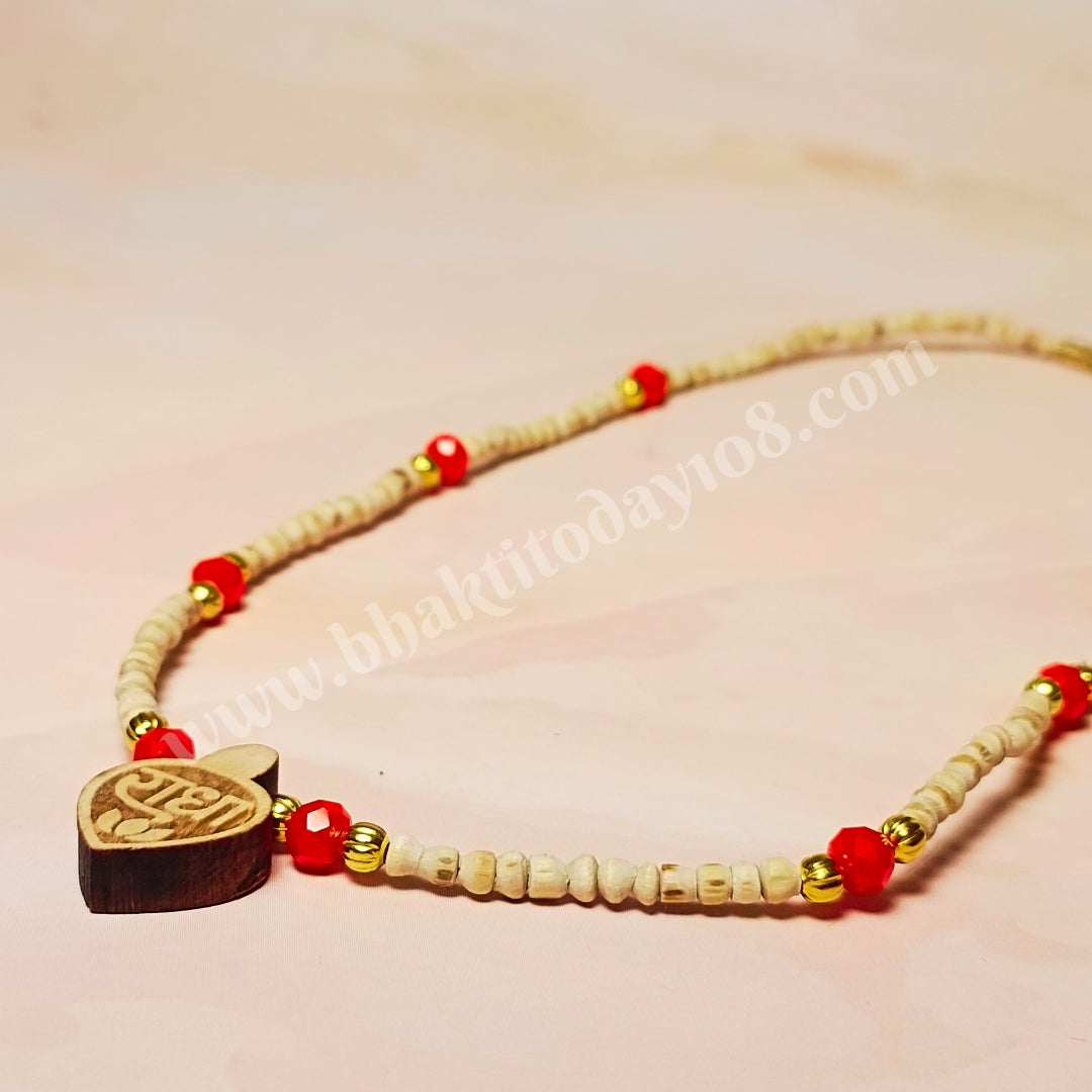 Radha Naam Golden Tulsi Mala with red and golden beads and a small Radha Naam locket – handcrafted spiritual necklace made from pure Tulsi wood.