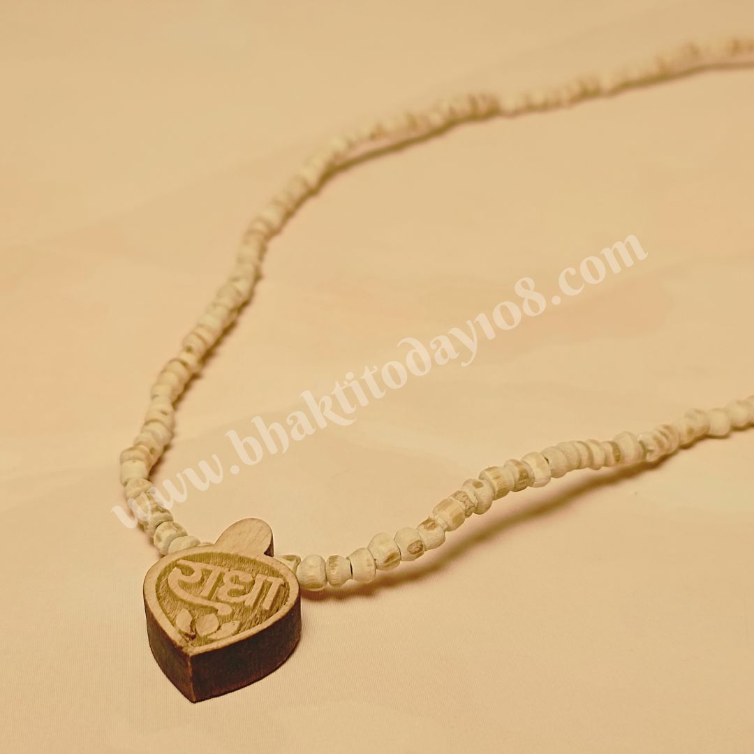 Vrindavan Tulsi Mala with Radha Naam engraved locket – handcrafted pure Tulsi beads from Vrindavan, symbolizing Radha Rani’s love, protection, and spiritual energy.