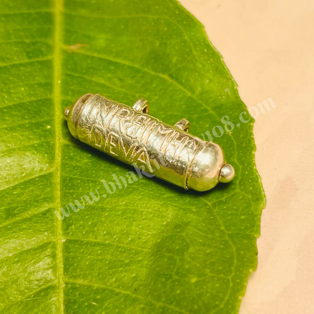 Pure Silver Narasimha Kavacham from Mayapur Dham, containing inscribed Narasimha Kavach stotra and sacred yajna ash for spiritual protection.