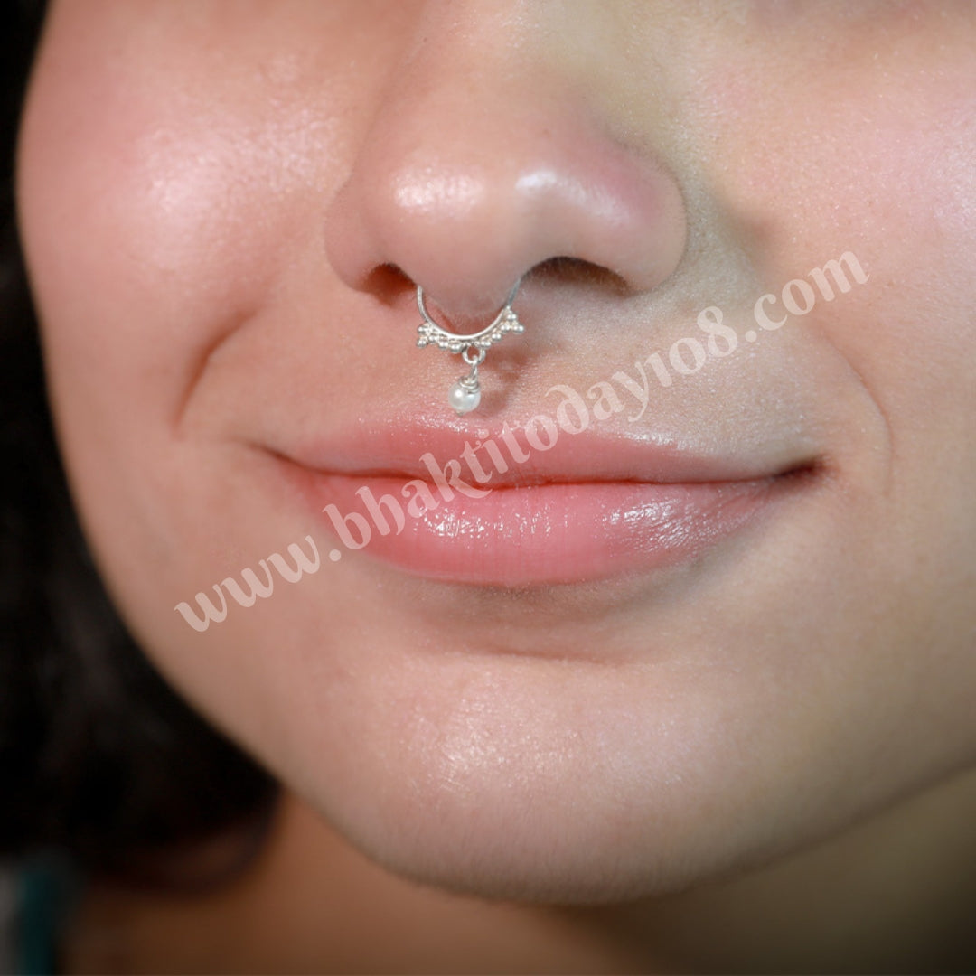 Sterling silver septum ring featuring a versatile design suitable for both septum and nostril piercings. Elegant and high-quality silver body jewelry.