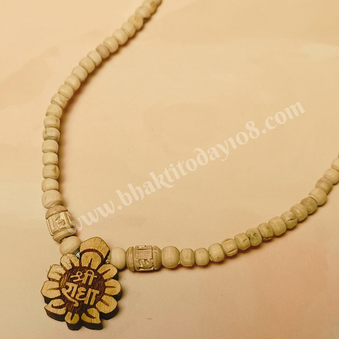 Handcrafted Radha Naam Tulsi Mala made with pure Tulsi wood beads, ideal for chanting, meditation, and spiritual protection, infused with Radha Krishna's blessings from Vrindavan.