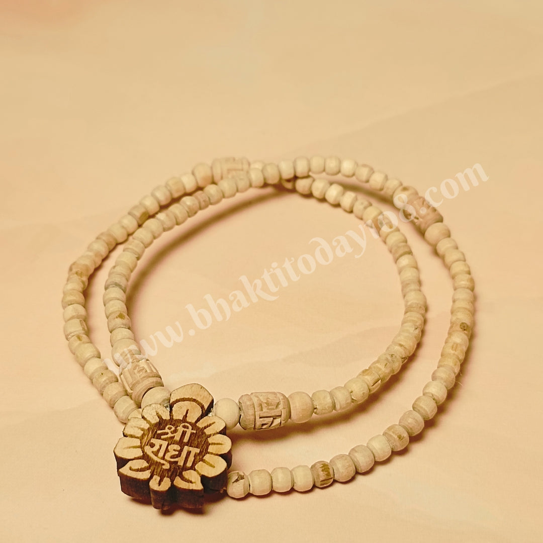 Handcrafted Radha Naam Tulsi Mala made with pure Tulsi wood beads, ideal for chanting, meditation, and spiritual protection, infused with Radha Krishna's blessings from Vrindavan.