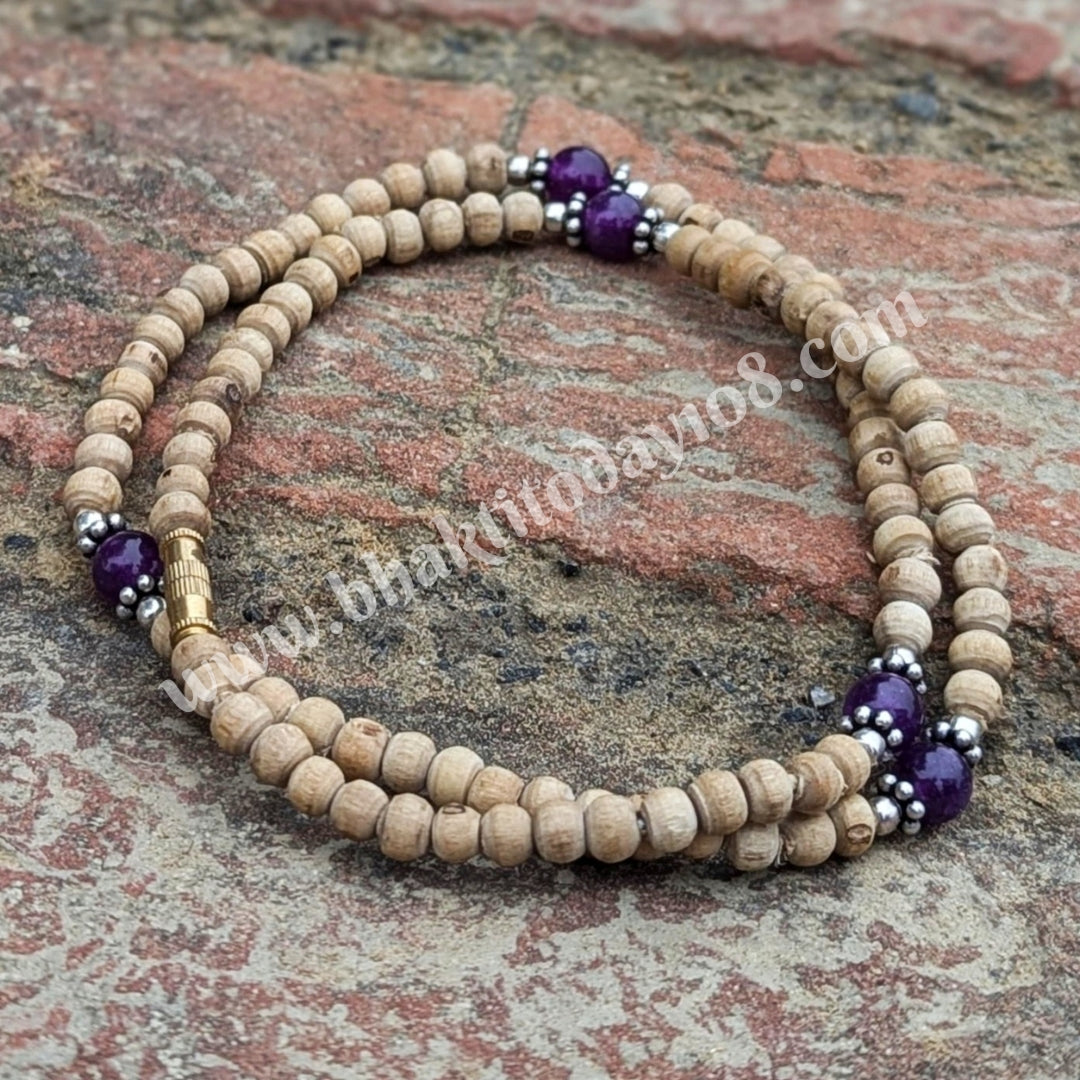 Tulsi mala with amethyst and silver beads – a handcrafted spiritual necklace combining sacred Tulsi wood with healing amethyst and pure silver accents.