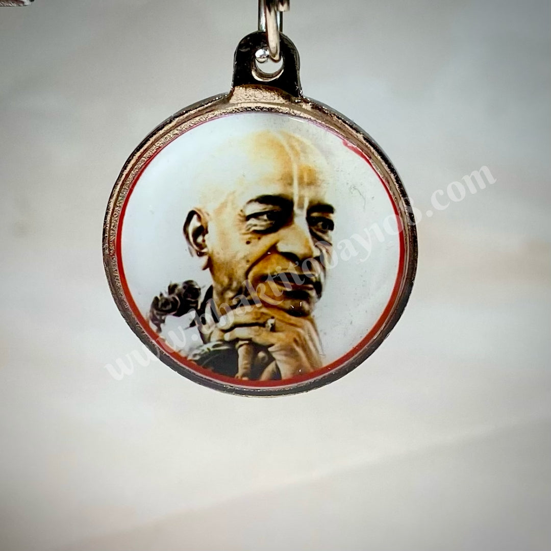 Durable steel locket featuring an engraved image of Srila Prabhupada, perfect for daily wear and devotional remembrance.