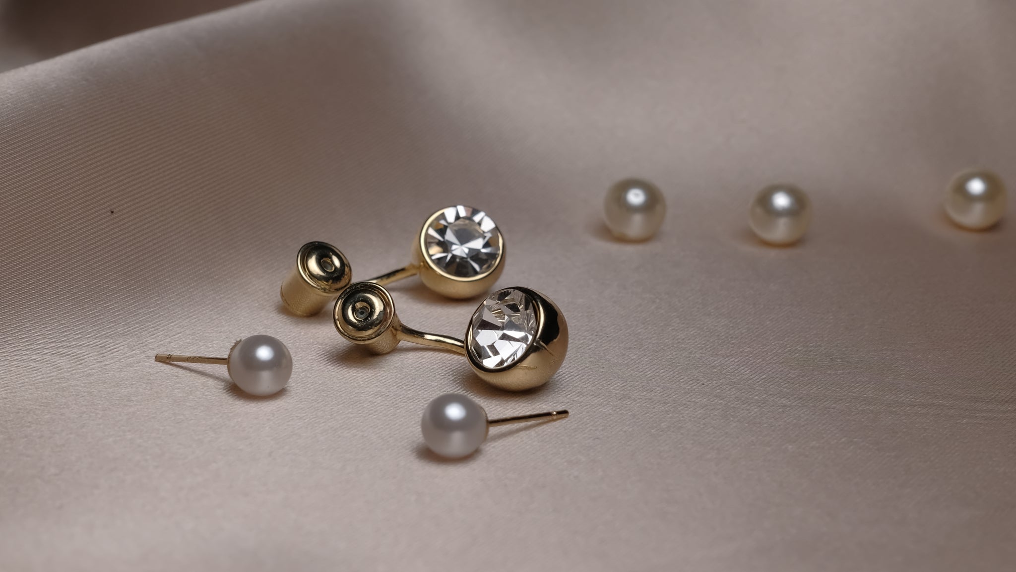 Pearl & Stone silver earrings featuring a harmonious blend of lustrous pearls and sparkling stones set in polished silver, offering a refined and elegant look.