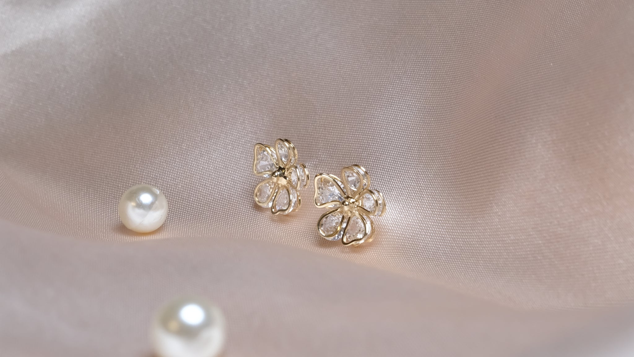 Gold-plated floral earrings featuring intricate petal designs with a radiant finish, combining elegance and nature-inspired charm.