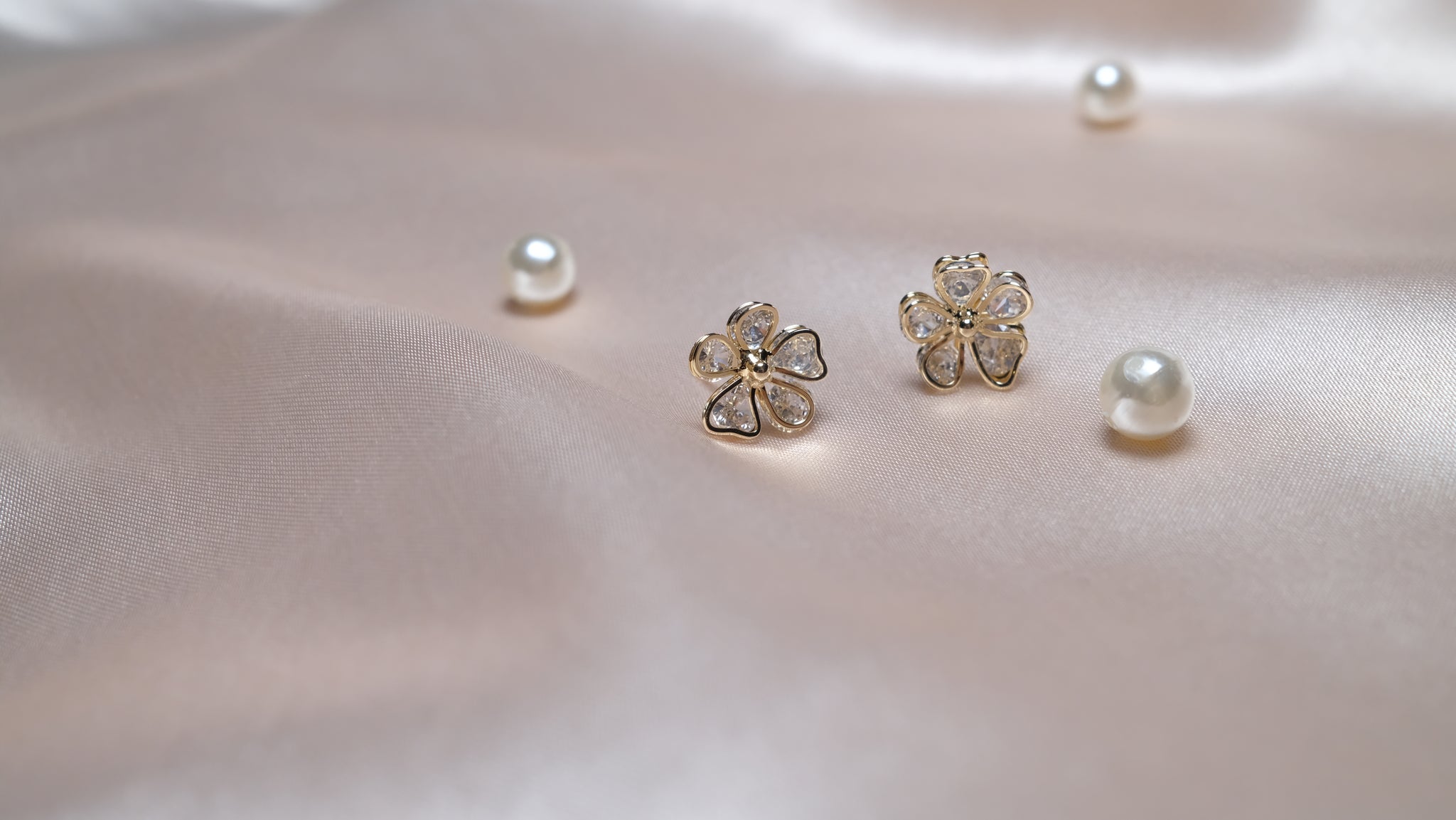 Gold-plated floral earrings featuring intricate petal designs with a radiant finish, combining elegance and nature-inspired charm.