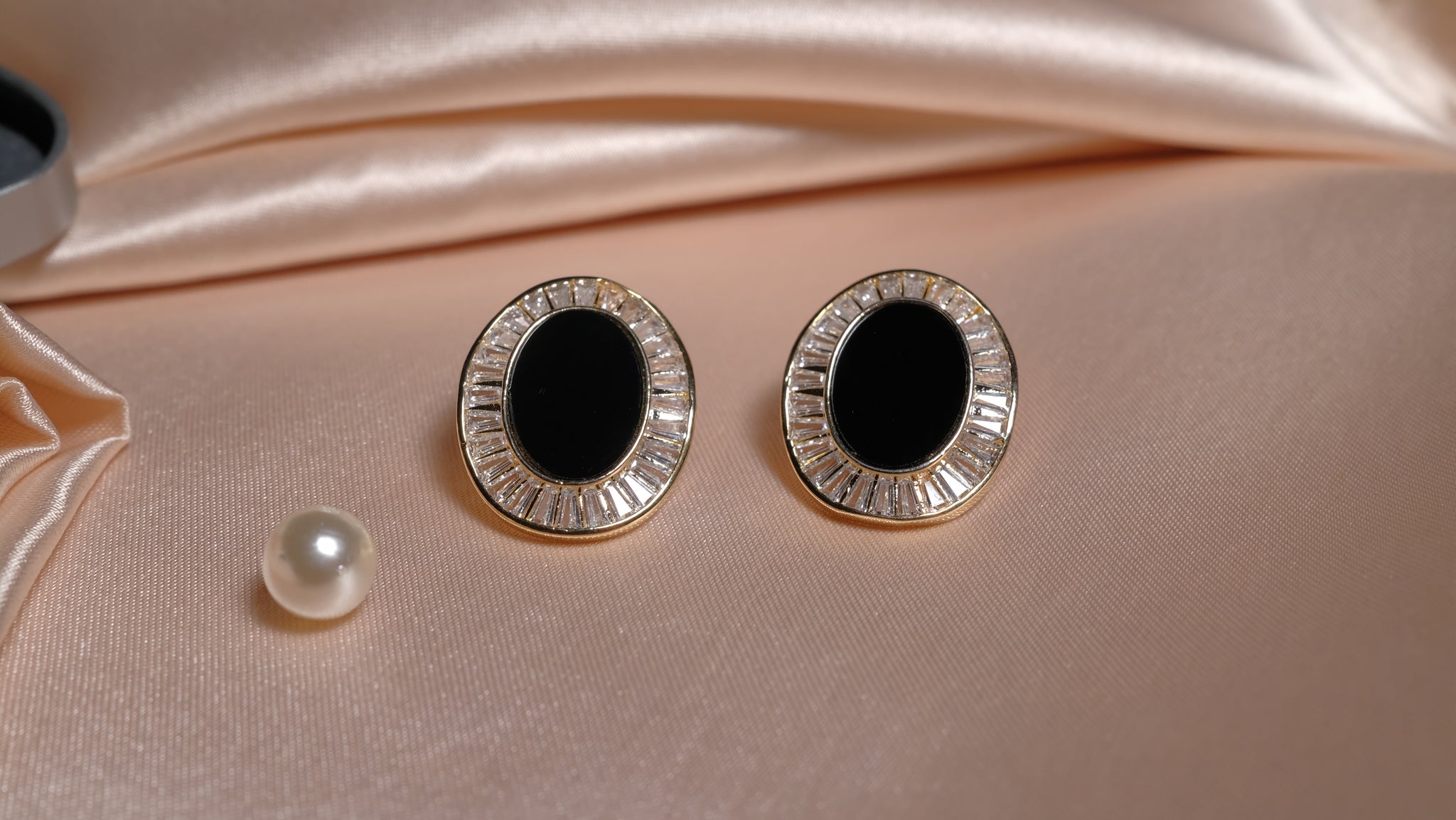 Black Mother of Pearl earrings featuring a lustrous dark iridescent finish, set in a refined design that combines elegance with natural beauty.