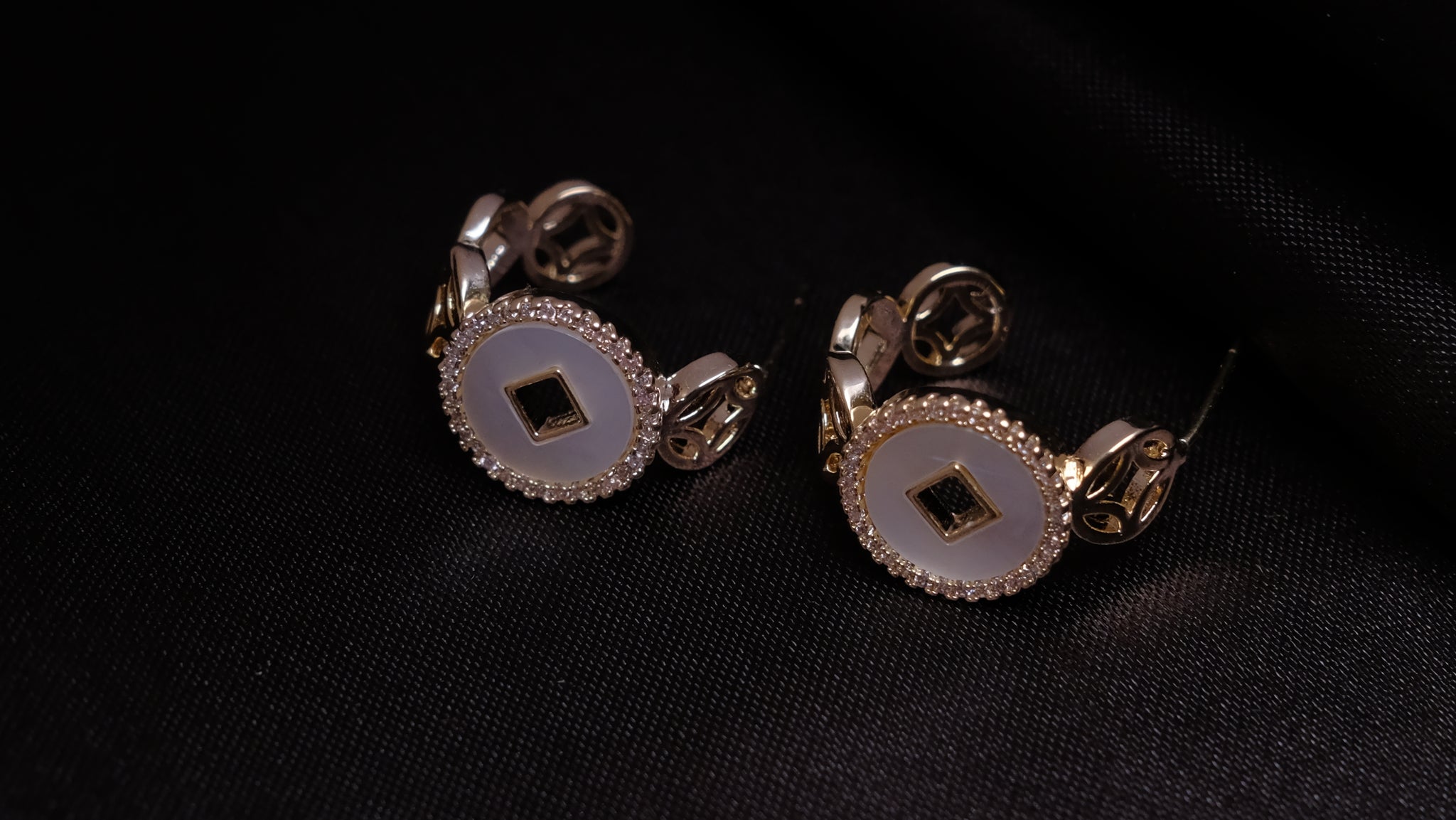 Moonlit Grace silver earrings with a sleek, graceful design, featuring a radiant silver finish that reflects soft, moonlight-inspired elegance.