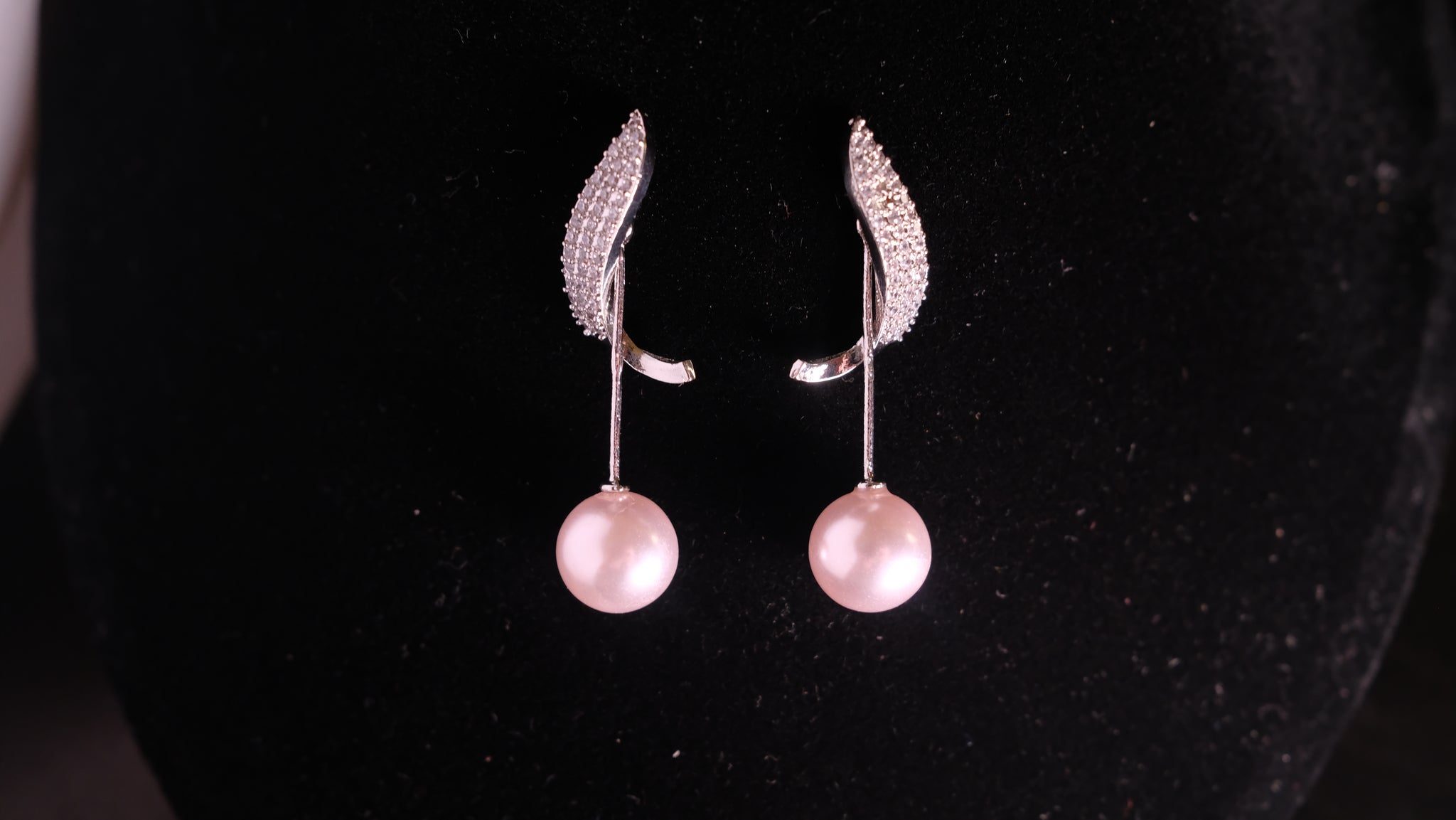 Pearl & Zircon silver earrings featuring lustrous pearls complemented by sparkling zircon stones, set in polished silver for a sophisticated and elegant look.