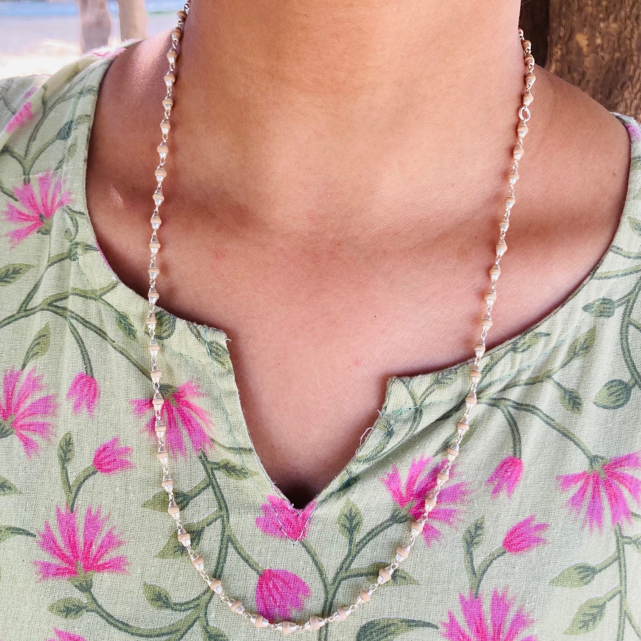 Sterling silver chain featuring small, round Tulsi seed beads.