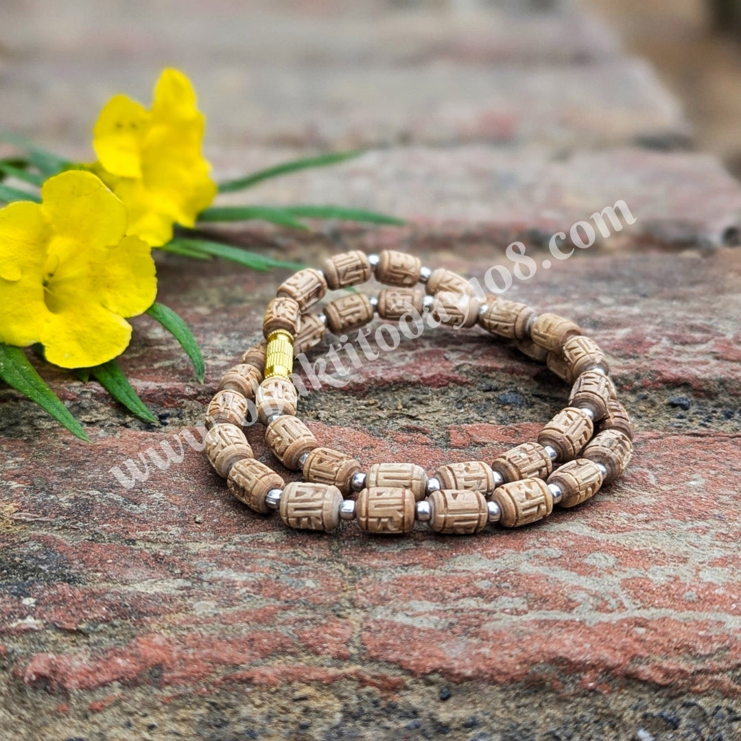 Tulsi Radha Naam mala with silver beads – a devotional necklace featuring sacred Tulsi wood inscribed with Radha Naam, accented by pure silver beads for spiritual significance.