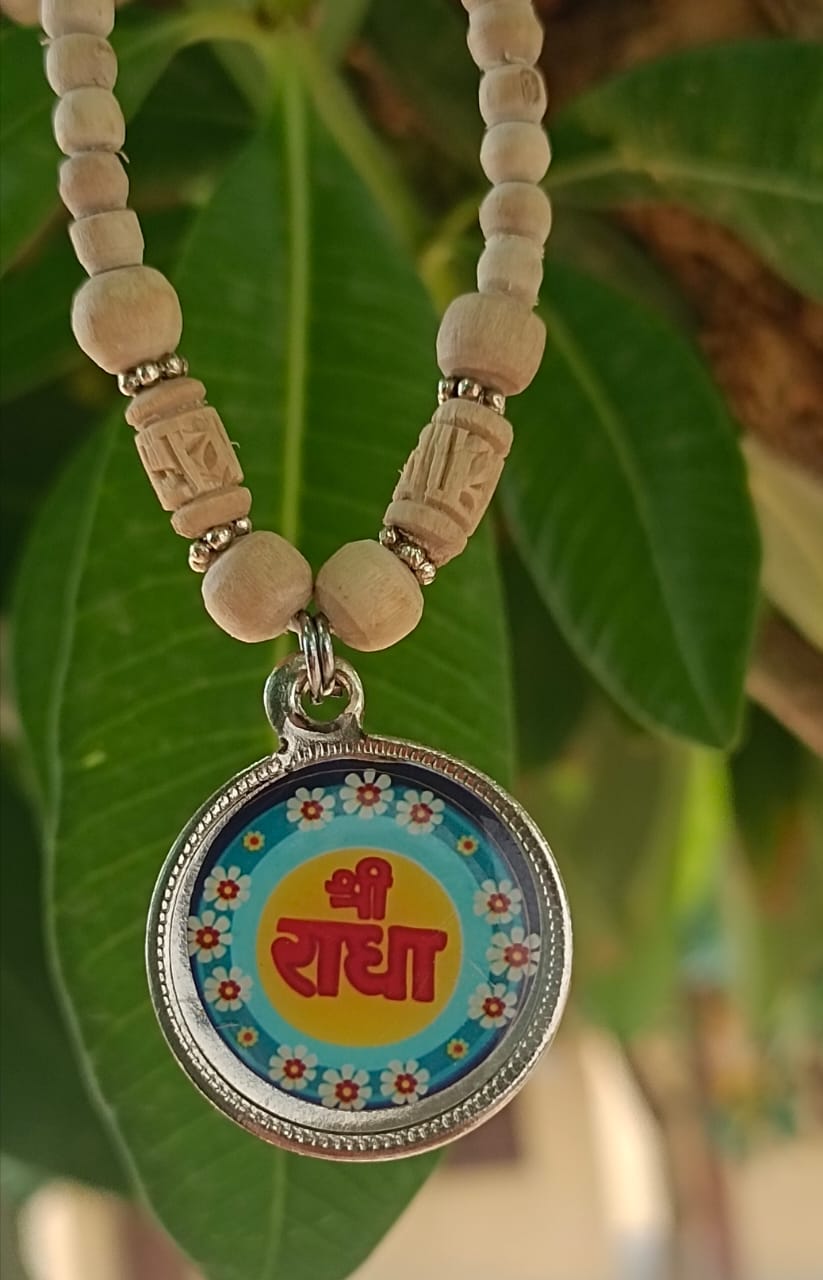 Handcrafted Radha Naam Tulsi Mala made with pure Tulsi wood beads, perfect for chanting, meditation, and spiritual protection, infused with Radha Krishna's blessings.