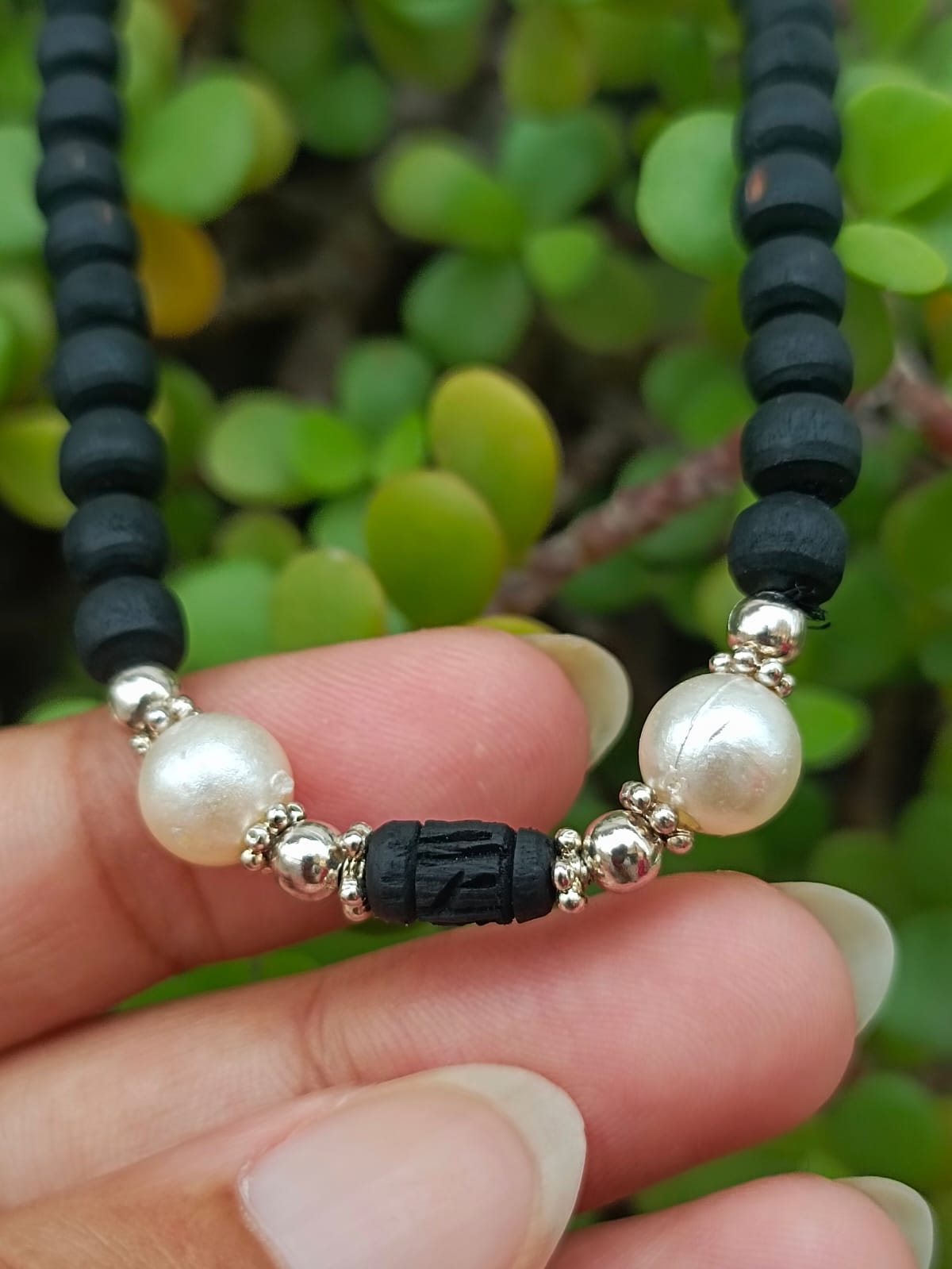 Shyam Tulsi Kanthi Mala handcrafted with pure Tulsi beads from Vrindavan, featuring carved Radha's name on each bead – a divine spiritual necklace for devotion and protection.