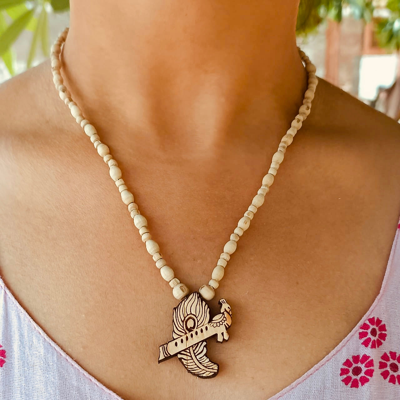 Flute & Peacock Feather Tulsi Kanthi Mala – Pure Vrindavan Tulsi beads with flute and peacock feather pendant, symbolizing Krishna’s divine presence and protection.