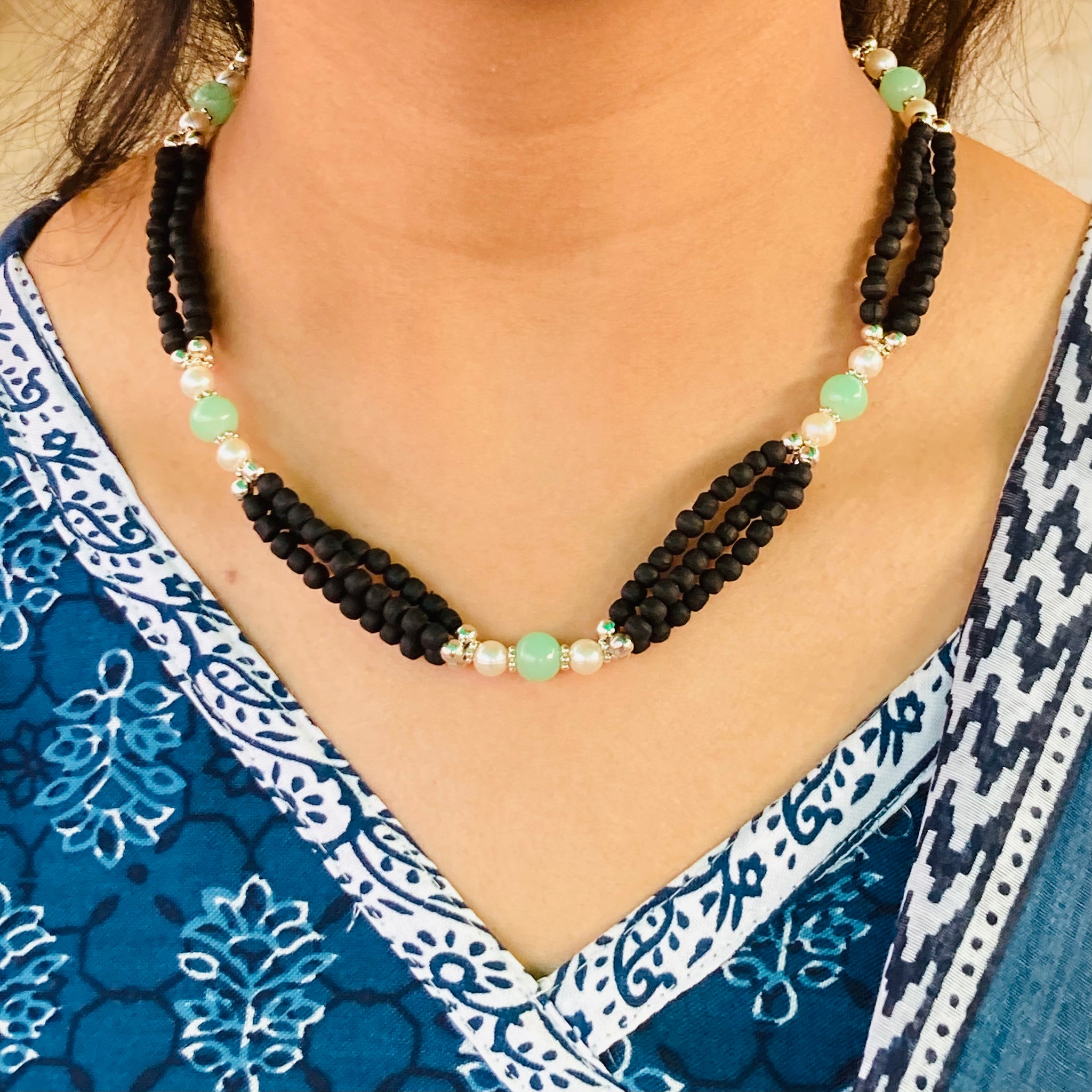 Three-layer pure Vrindavan Tulsi beads with silver accents and shining stones, offering divine protection and spiritual elegance.