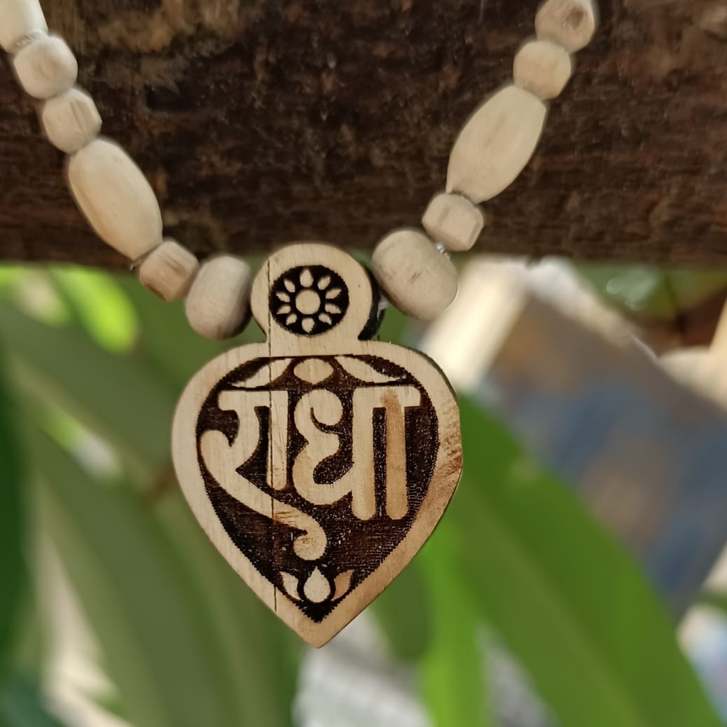 Handcrafted Radha Naam Tulsi Mala with pure Tulsi beads and Radha locket, offering spiritual protection, devotion, and divine love from Vrindavan.