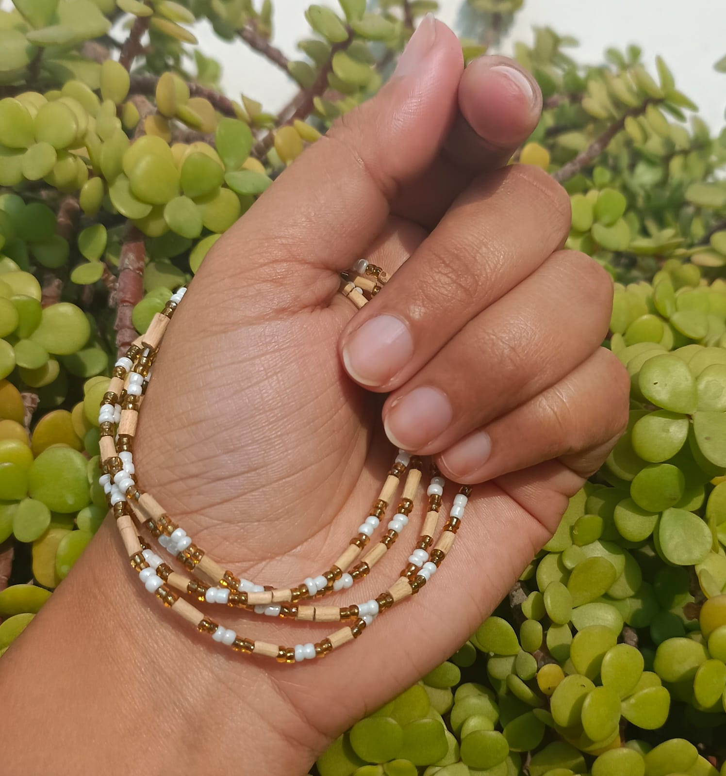 2 Round Tulsi Kanthi Mala with golden beads, handcrafted from pure Tulsi wood for spiritual protection, and devotion. Perfect for daily wear.