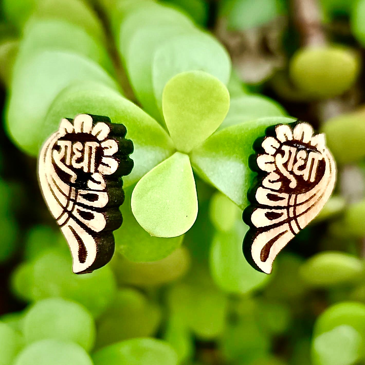 Radha Naam Tulsi ear studs handcrafted from pure Tulsi wood with sacred Radha engraving, spiritual earrings for Krishna devotees.

